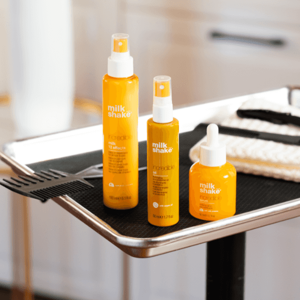 The milk_shake Incredible Collection displayed on a salon tray, featuring the incredible milk, incredible oil and incredible serum.