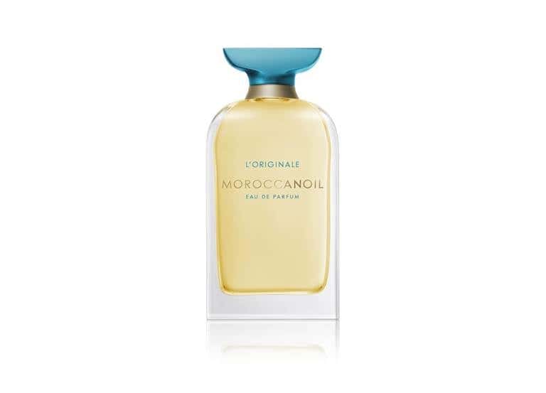 Moroccanoil's fine fragrance perfume bottle has a golden liquid and teal cap