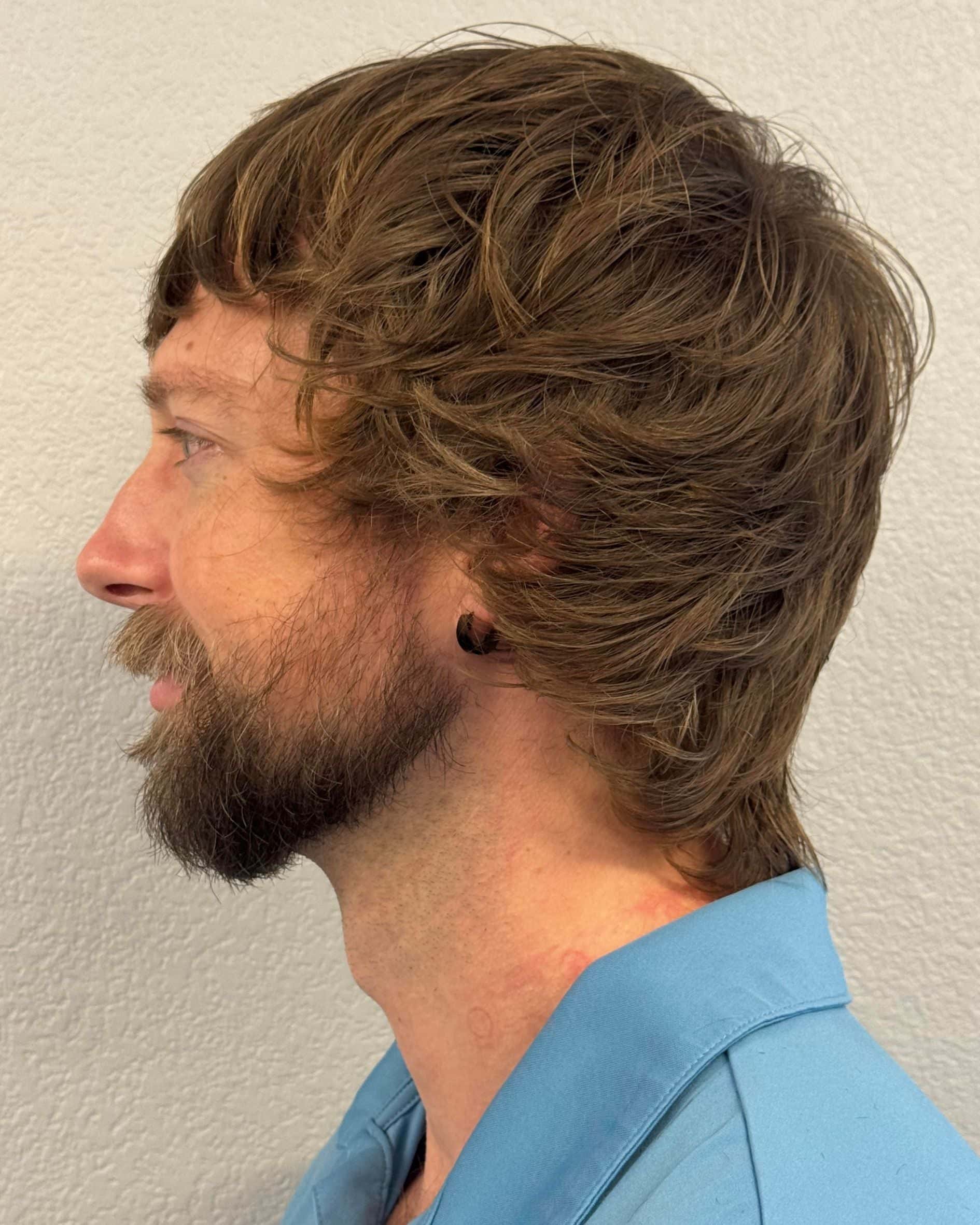 Modern mod haircut side profile showing layered structure, movement and blended shape