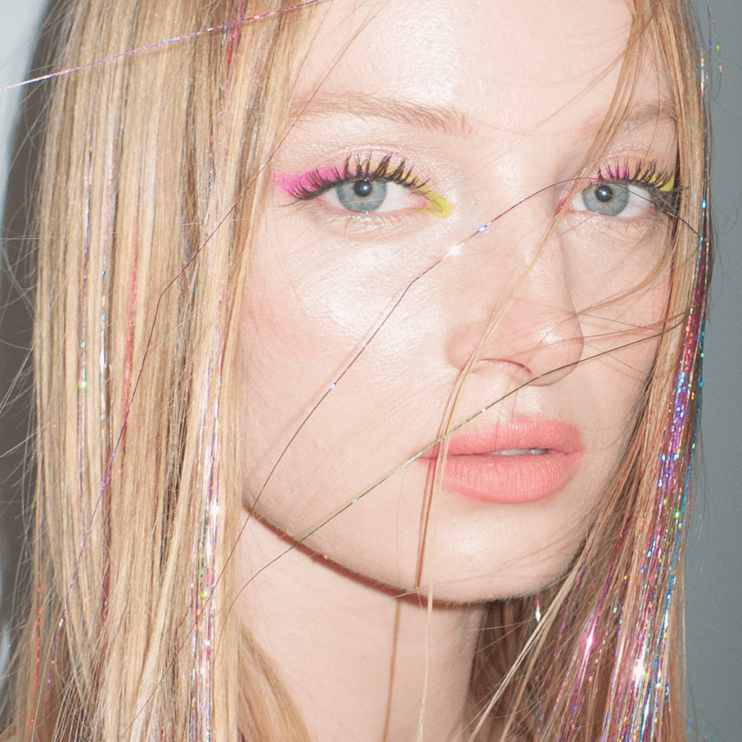 long blonde hair with pink tinsel
