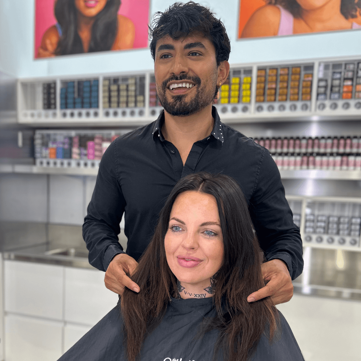 client and stylist smiling in the chair