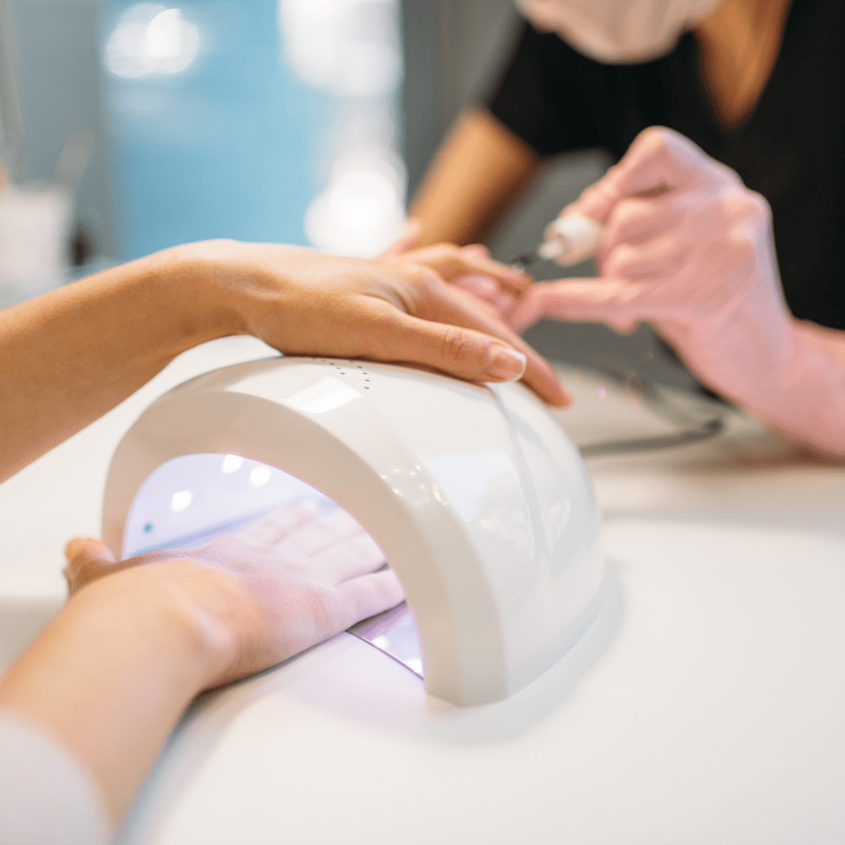 Gel manicure under UV light
