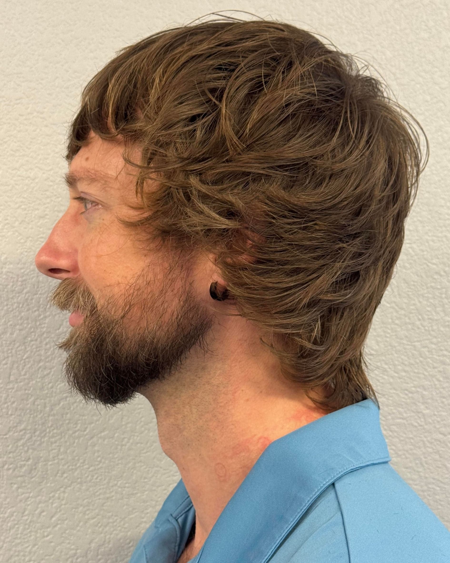 Modern mod haircut side profile showing layered structure, movement and blended shape
