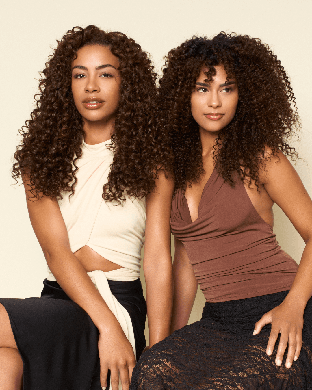Models wearing The Hair Shop Curly Collection featuring Loose Spiral and Deep Spiral textures