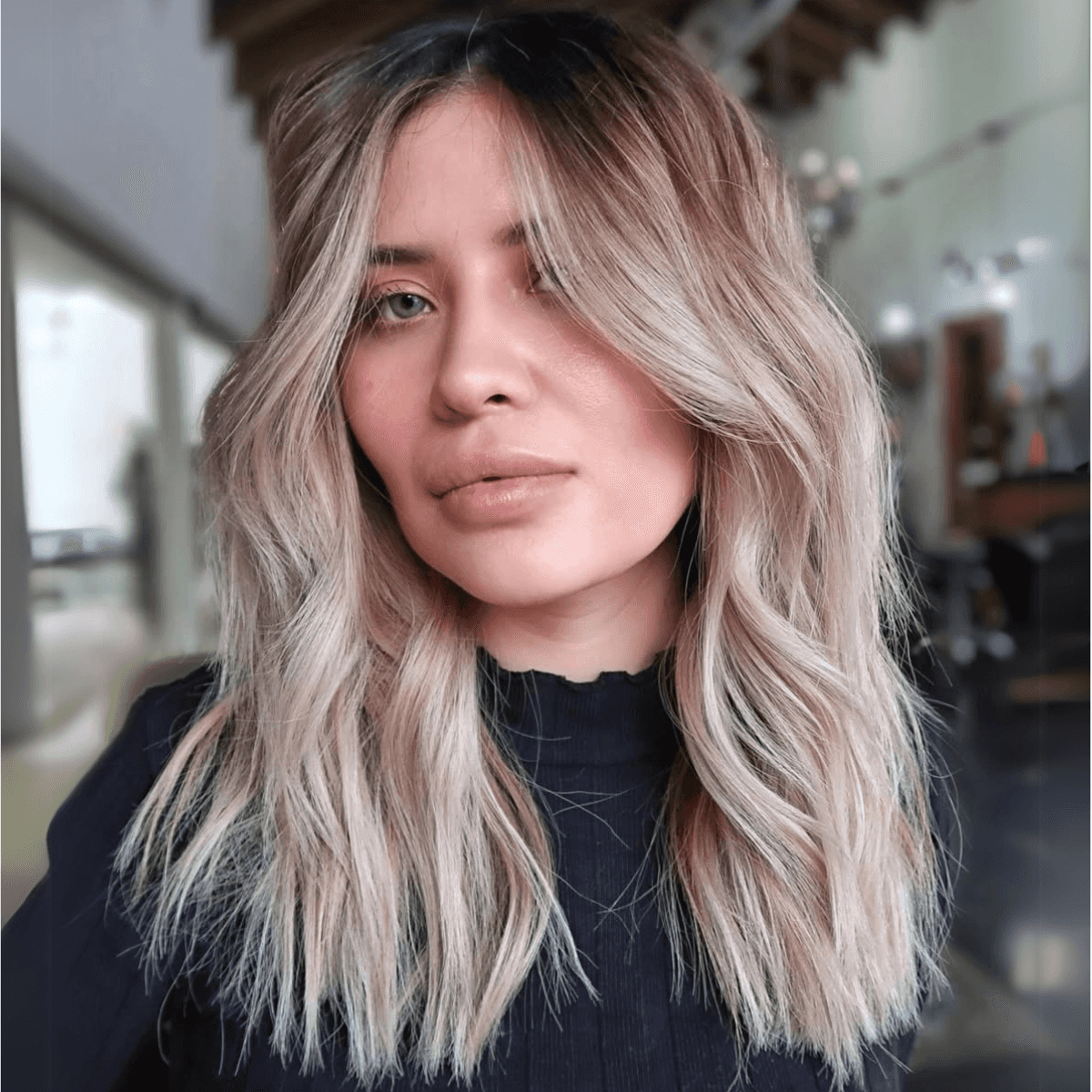model with blonde ombre hair posing