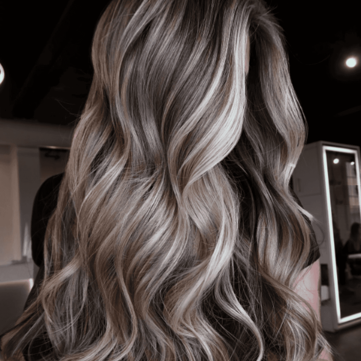 Cool-toned bronde with ash-blonde highlights and seamless blending.