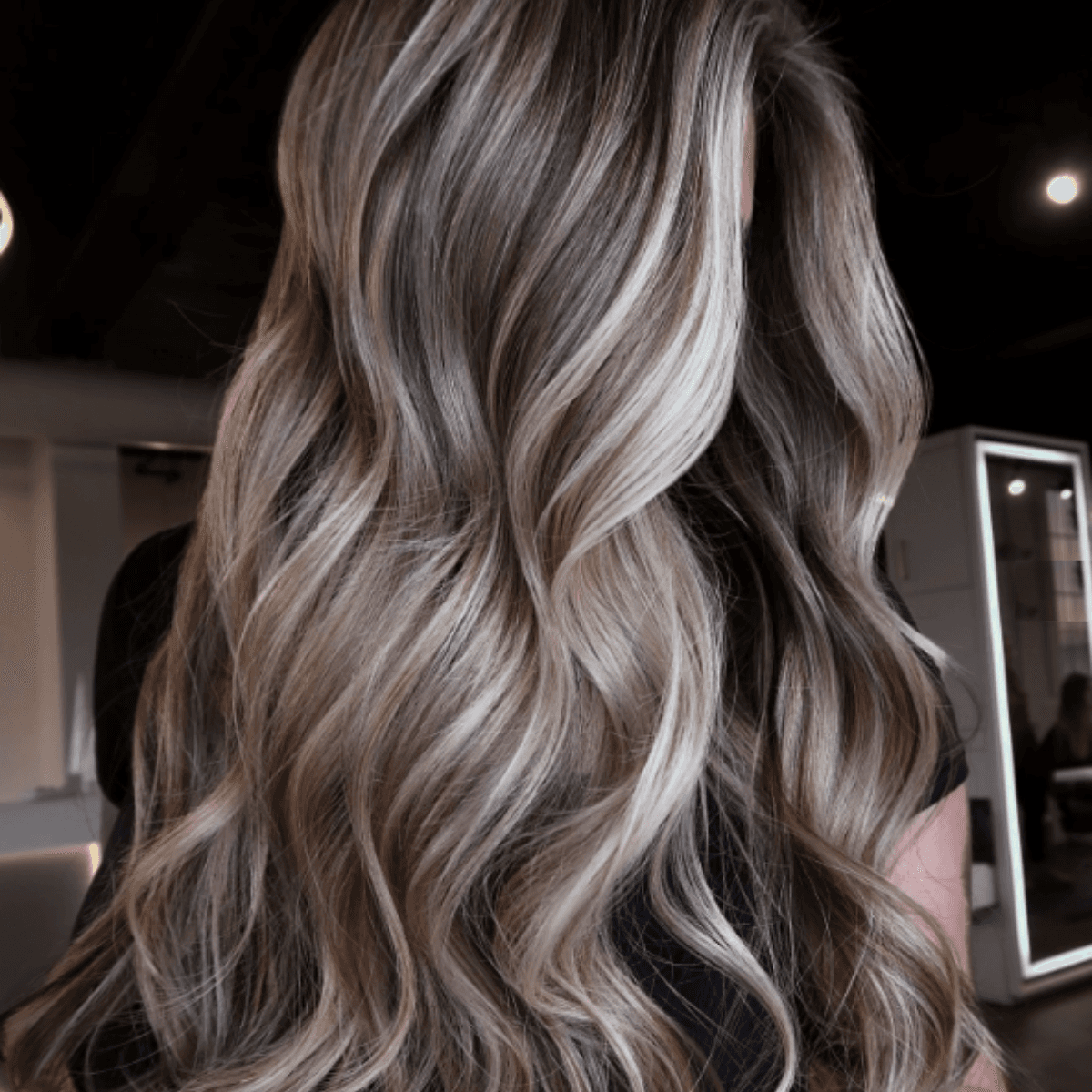 Cool-toned bronde with ash-blonde highlights and seamless blending.