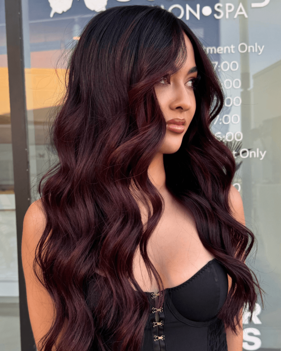 plum hair color wavy blowout