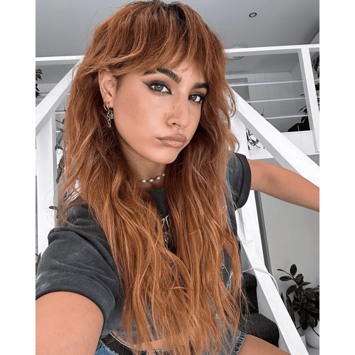 model with a red shag styled