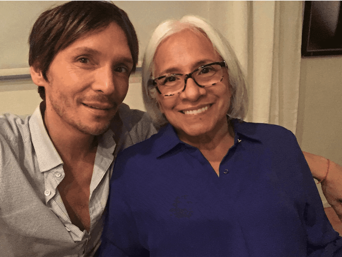Ken Pavés, and his mom Helen sitting together smiling