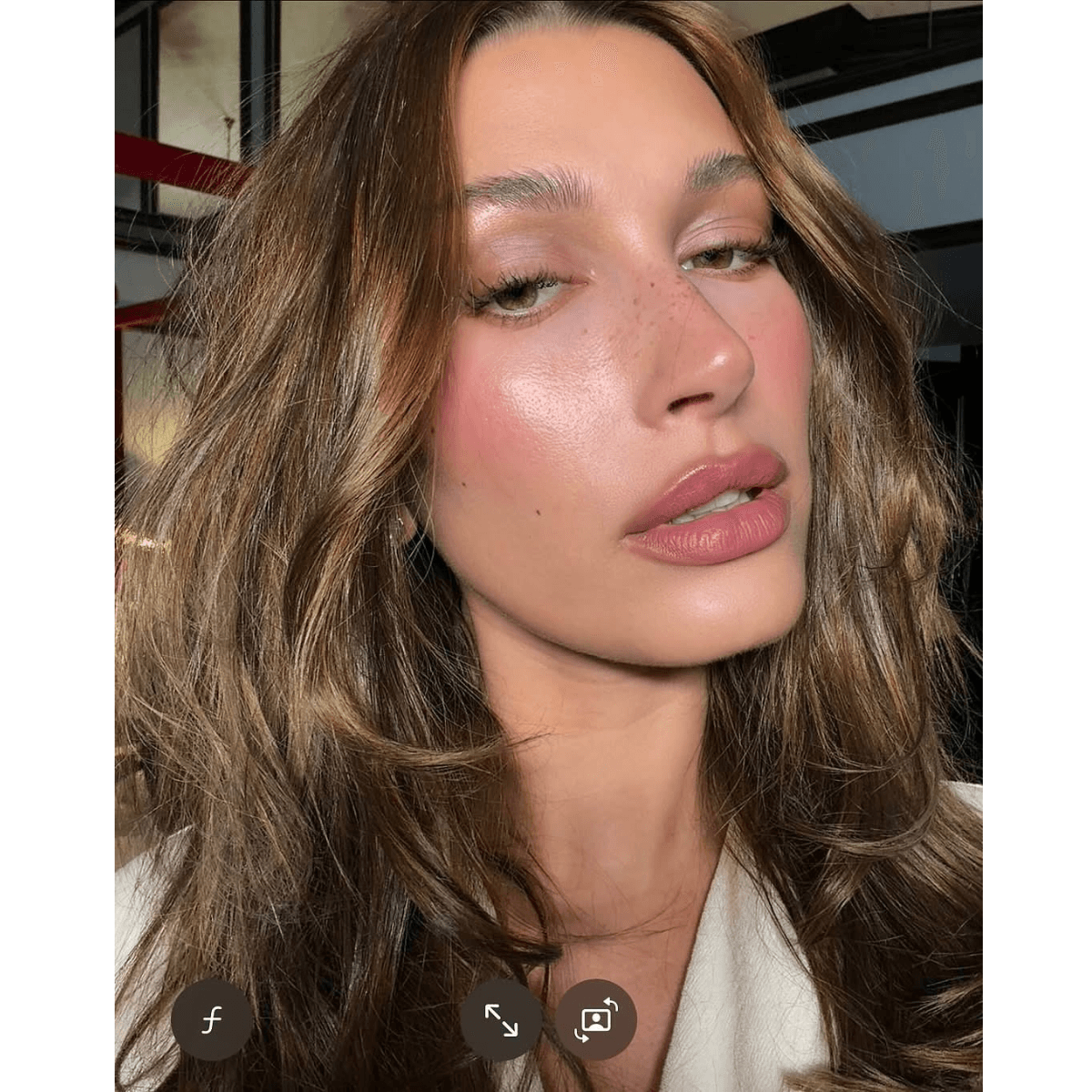 hailey bieber with a glossy lob