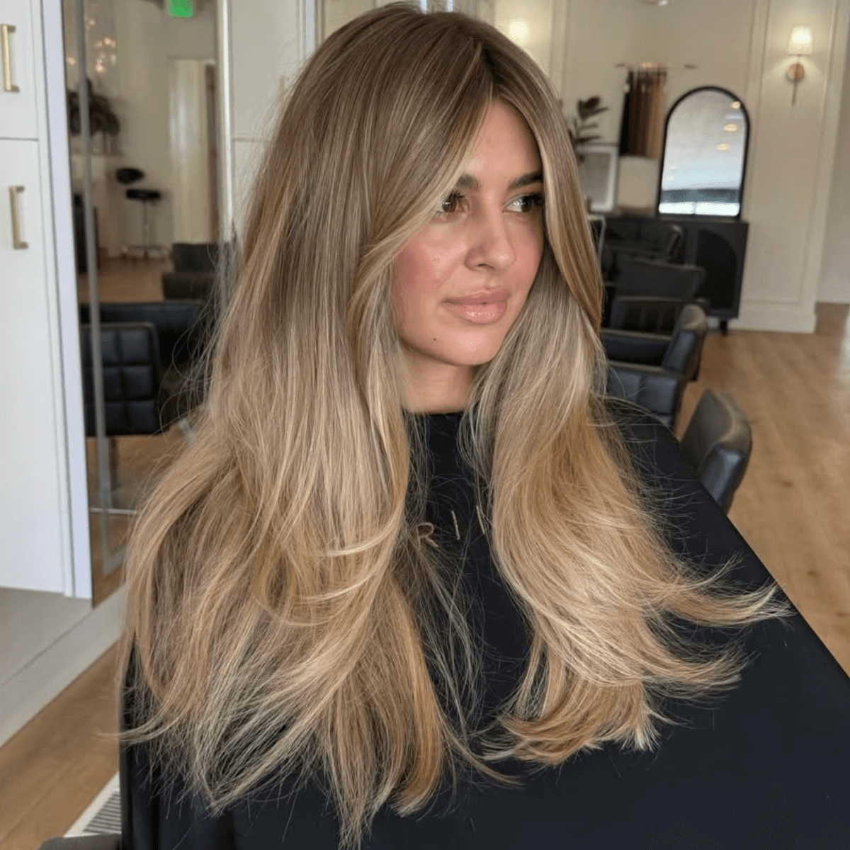long brown butter blonde hair Photo Credit Instagram via @hairbysadiep