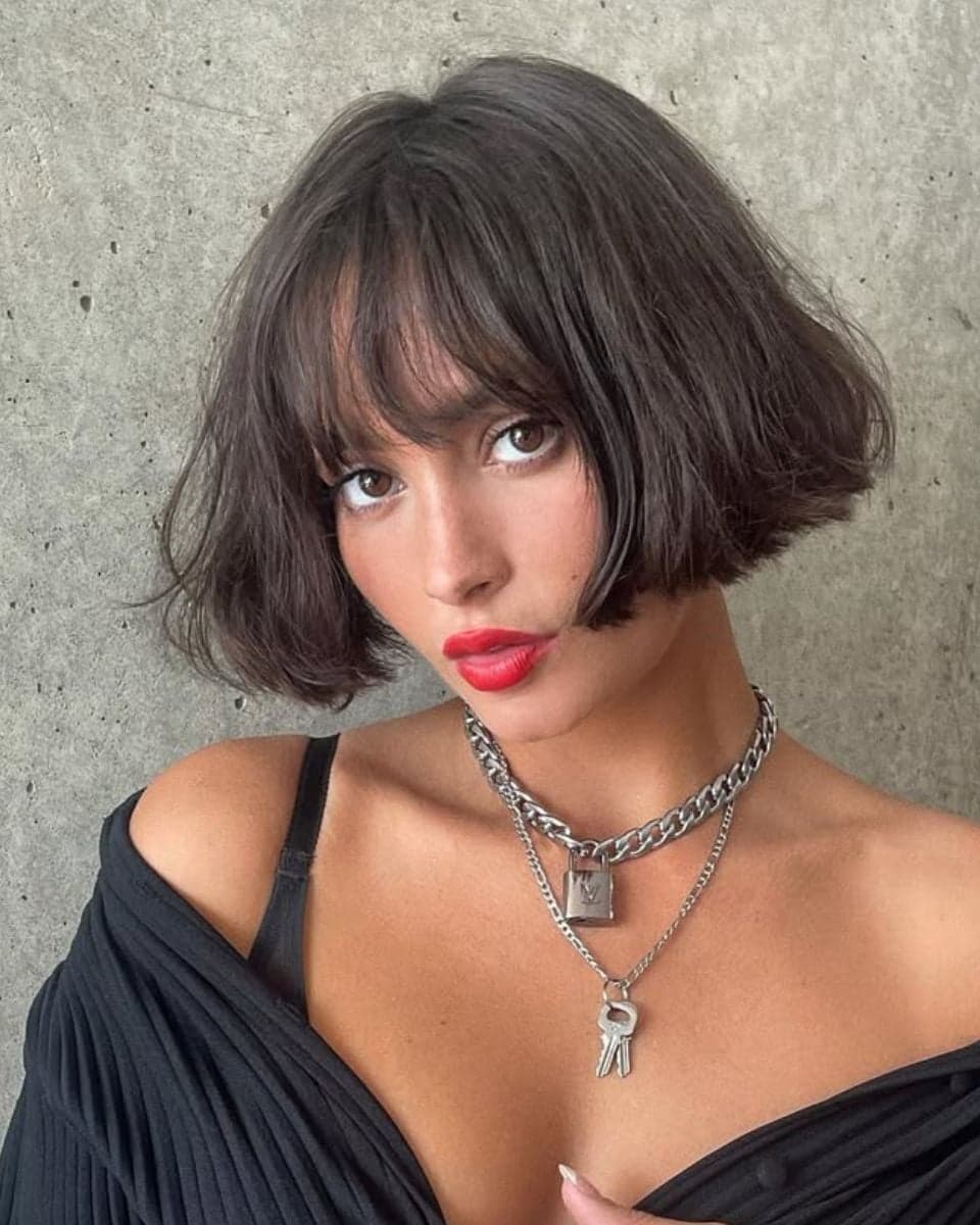 Short airy bob with soft fringe and tousled texture, a key spring/summer haircut trend for effortless movement.