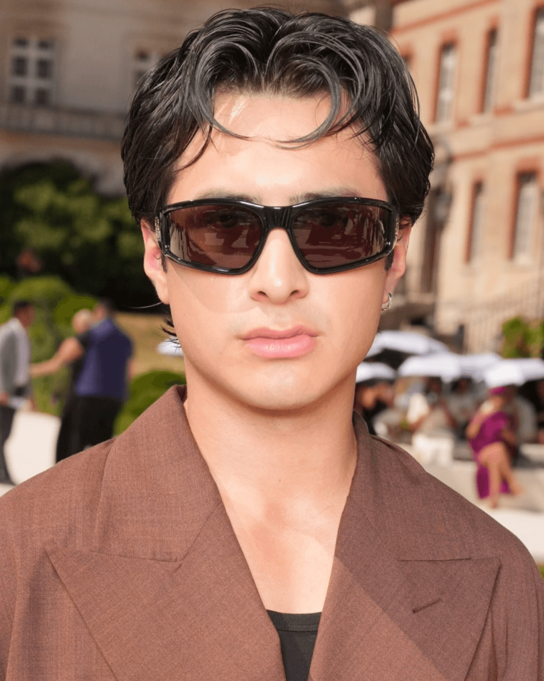 Hudson Williams wearing a modern '90s heartthrob hairstyle with soft movement, piecey texture and lived-in shine Hudson Williams Photo Credit Instagram via @by.aikaflores