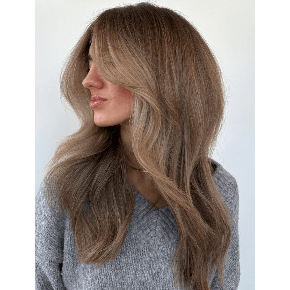 brown butter blonde medium length hair with long fringe