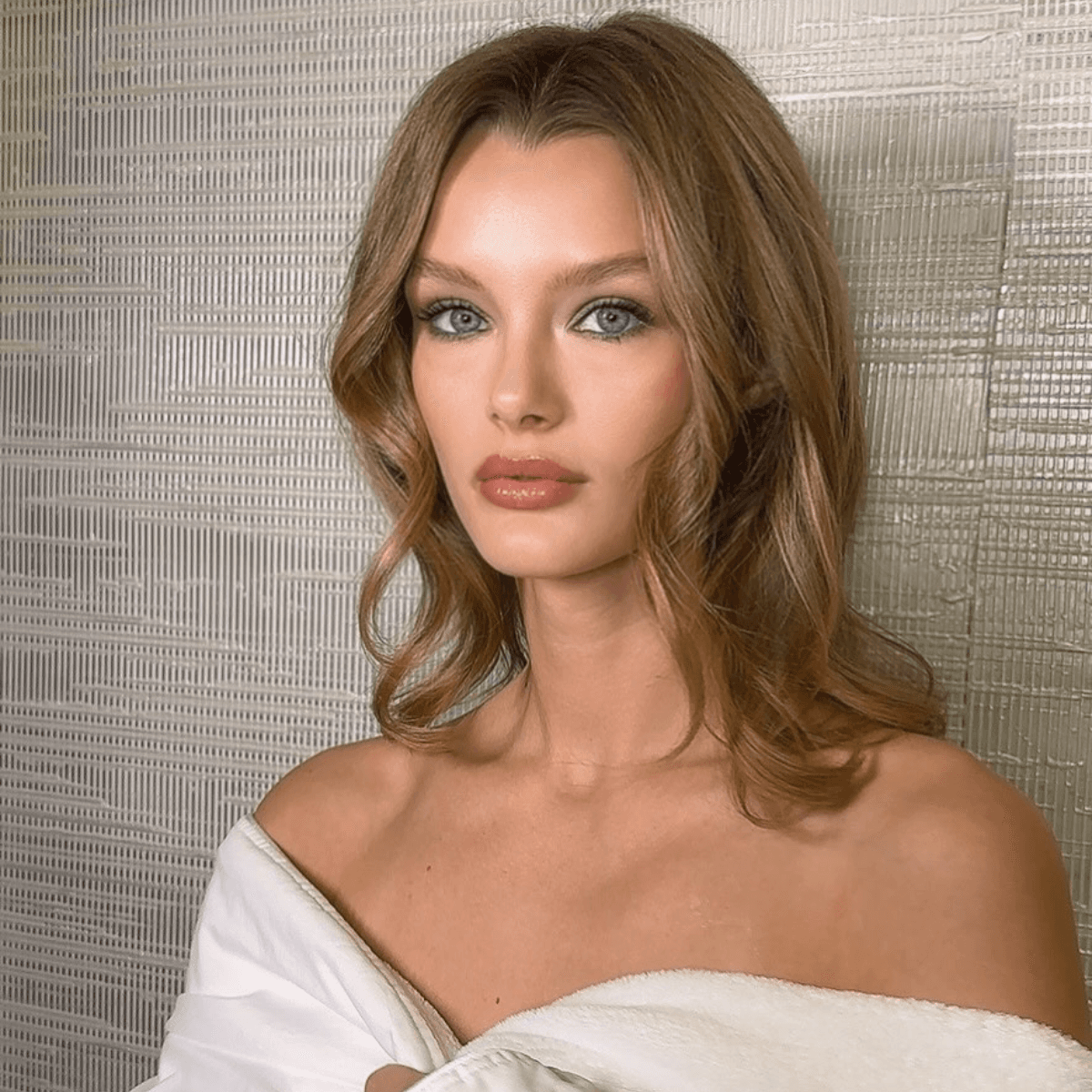 brown butter blonde on a lob with soft curls