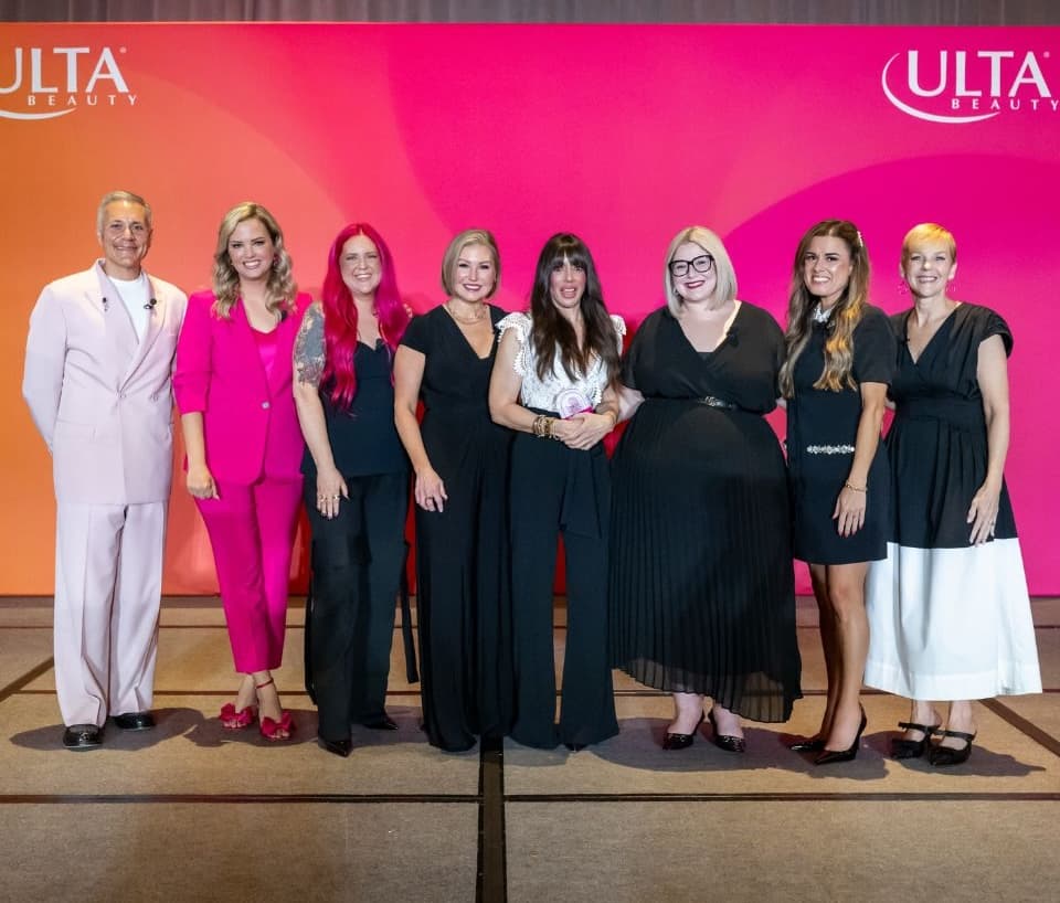 Ulta Beauty leaders and award honorees pose onstage with Sarah Bettura during Field Leadership Conference in Orlando.